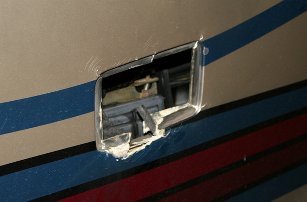 Prevost H3-40 Collision - Bay door damaged