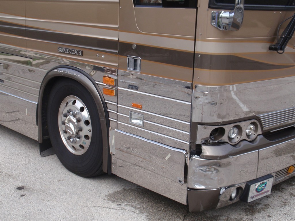 Prevost XL II Collision - Passenger side front corner damage before repairs by Excalibur Coach