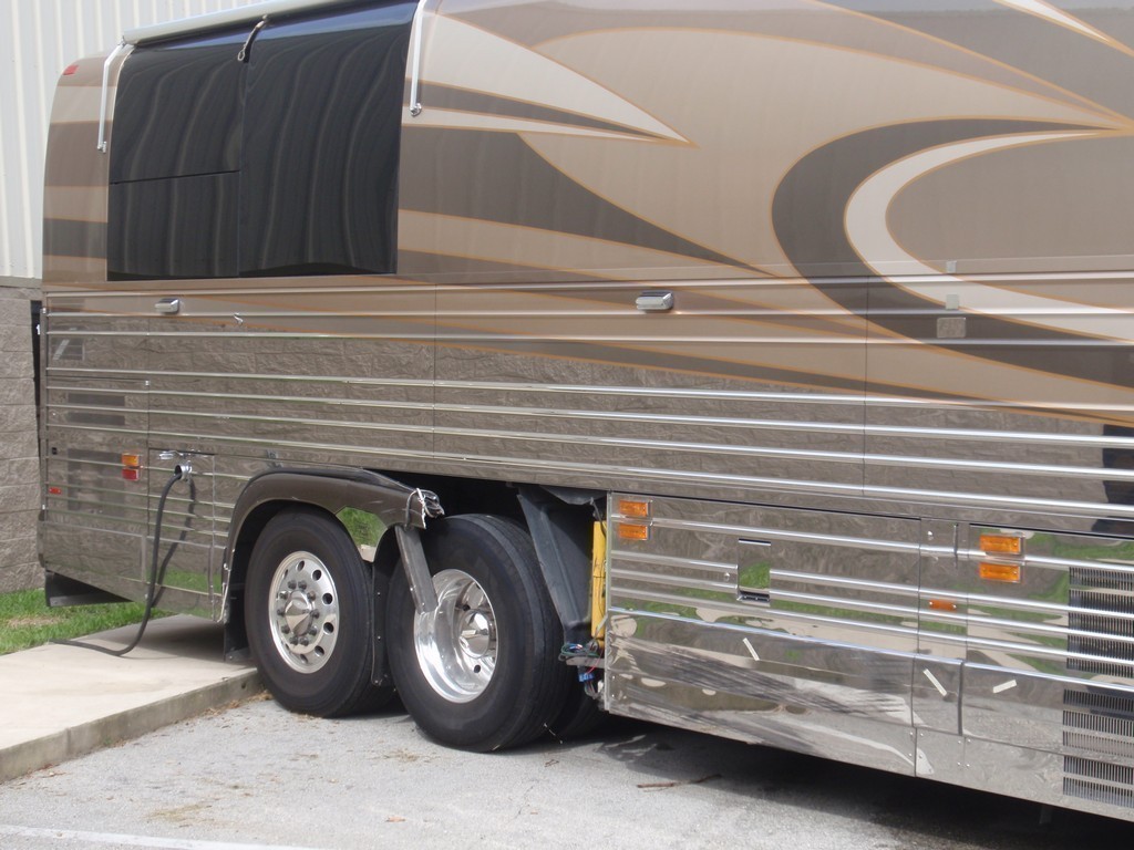 Prevost XL II Collision - Passenger side back damage before repairs by Excalibur Coach