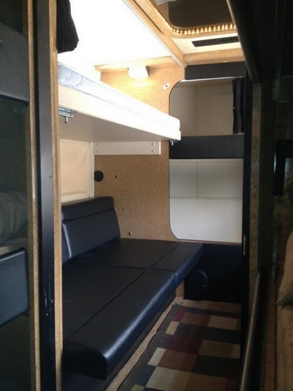 Prevost H3-45 Entertainer Bunk Coach Rear Salon Conversion by Excalibur Coach