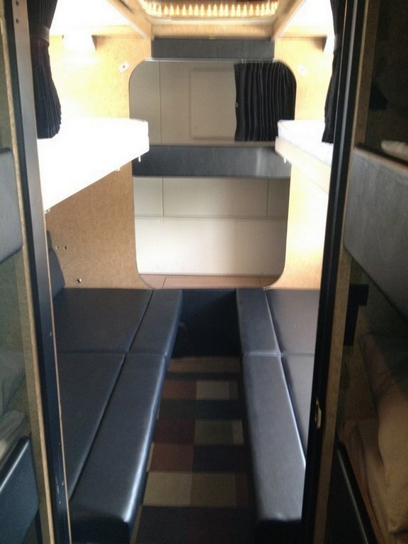 Prevost H3-45 Entertainer Bunk Coach Rear Salon Conversion by Excalibur Coach