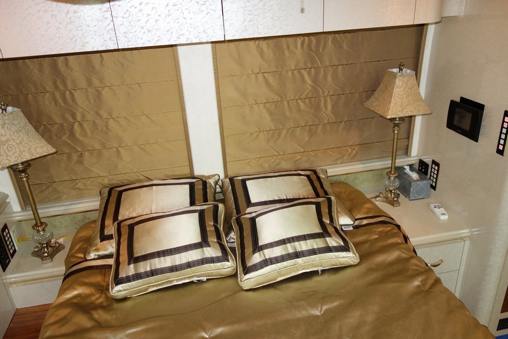 01Prevost Marathon XL II by Excalibur Coach bedroom before king bed and modified end cabinets