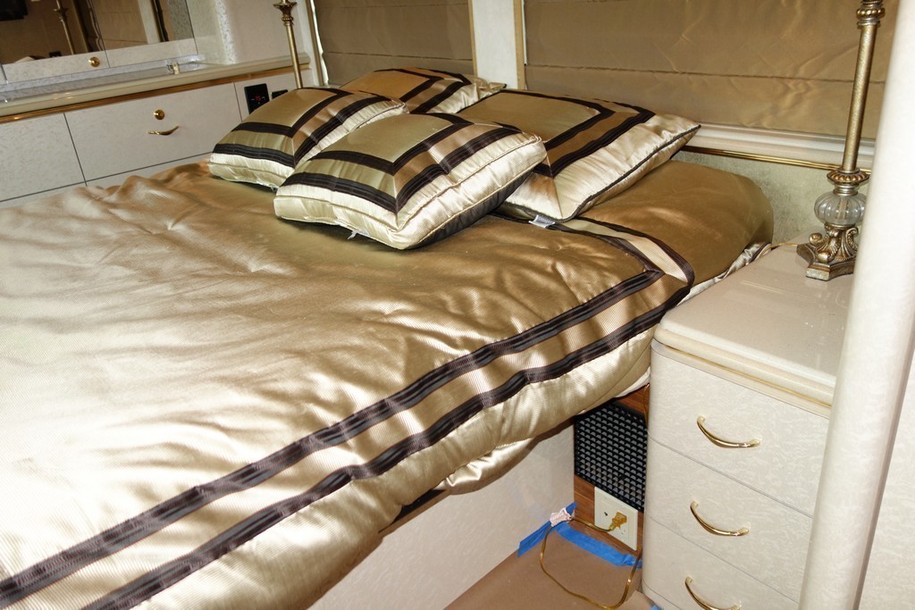 Prevost Marathon XL II by Excalibur Coach bedroom before king bed and modified end cabinets