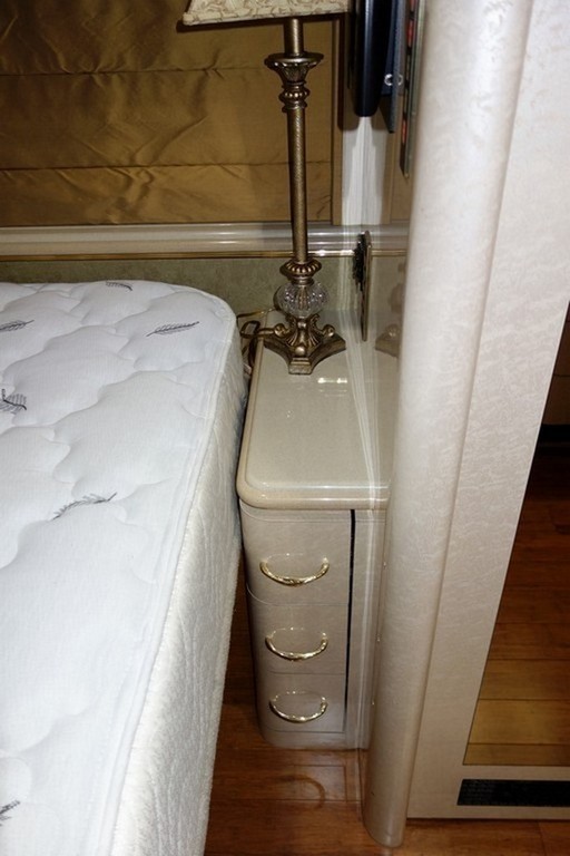 Prevost Marathon XL II by Excalibur Coach bedroom after new king bed and modified end cabinets by Excalibur Coach