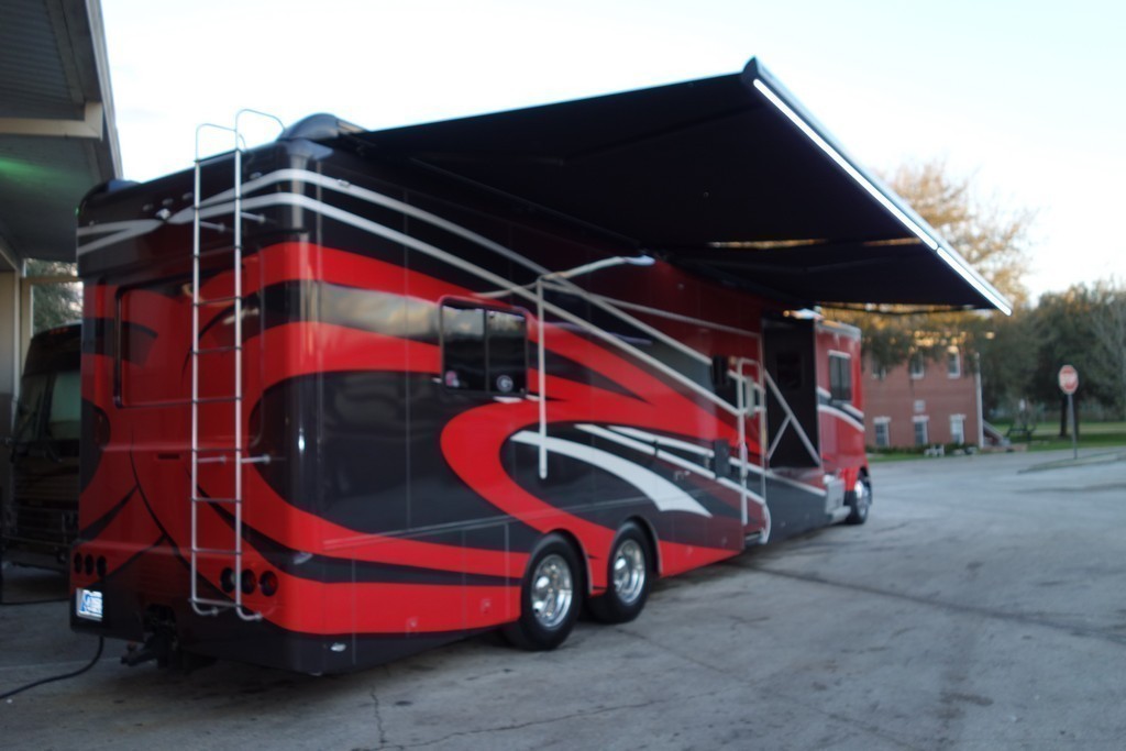 Showhauler Motorhome with LED lights on Awnings by Excalibur Coach