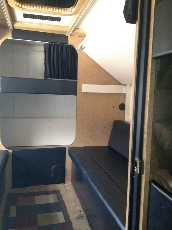 Prevost H3-45 Entertainer Bunk Coach Rear Salon Conversion by Excalibur Coach