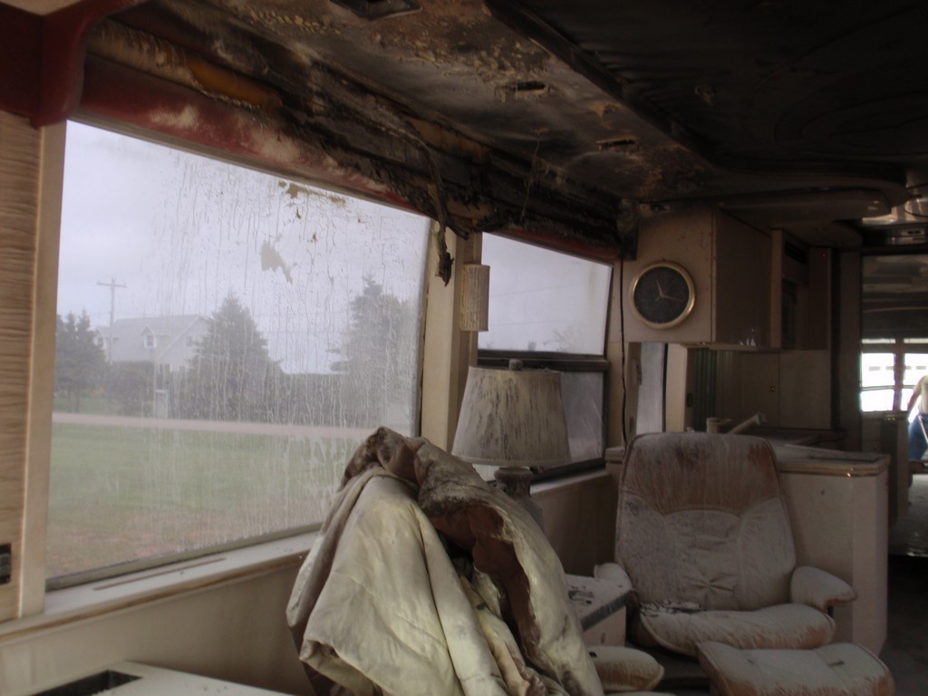 Prevost H3-45 interior fire damage to salon before refurbished by Excalibur Coach