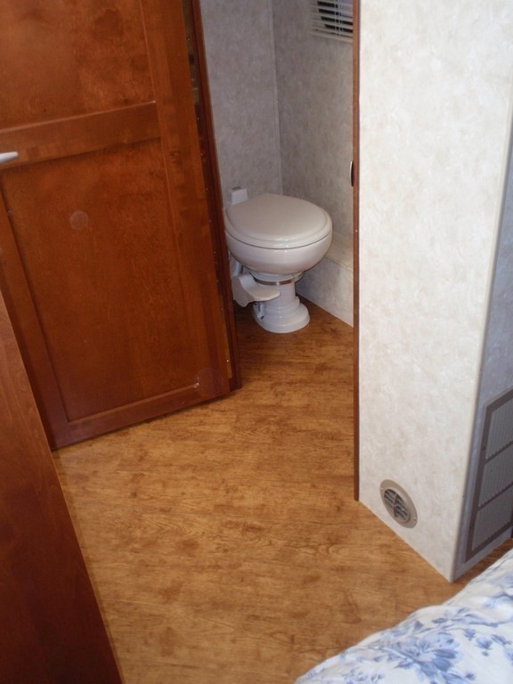 Monaco with New Vinyl Wood planking in bathroom by Excalibur Coach - Floor - Prevost Motorhome - H3-45 - XL - XLII - Marathon - Entertainer