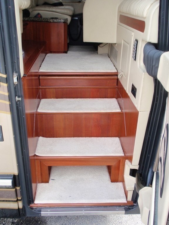 Featherlite New Vinyl Wood Planking on Stairwell with carpet treads by Excalibur Coach - Floor - Prevost Motorhome - H3-45 - XL- XL