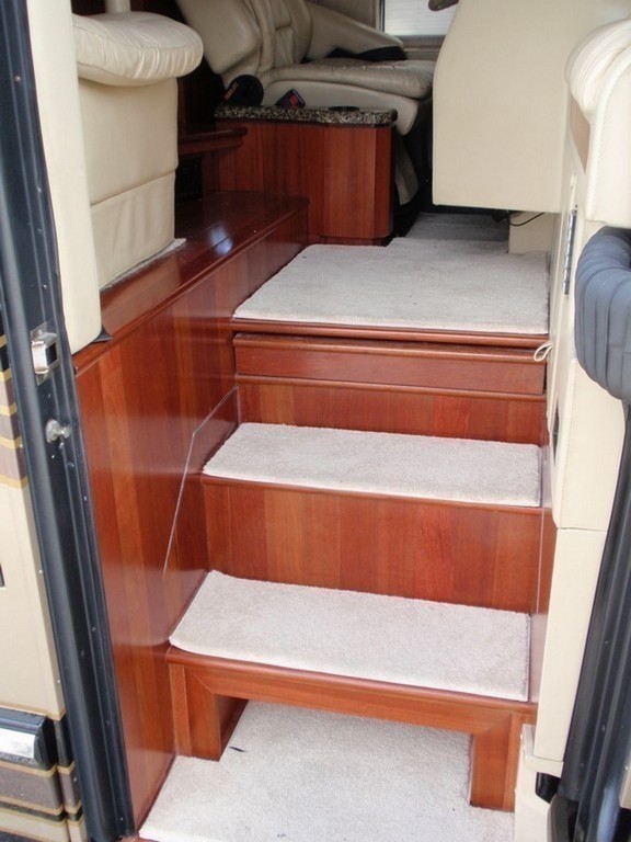 Featherlite New Vinyl Wood Planking on Stairwell with carpet treads by Excalibur Coach - Floor - Prevost Motorhome - H3-45 - XL- XL