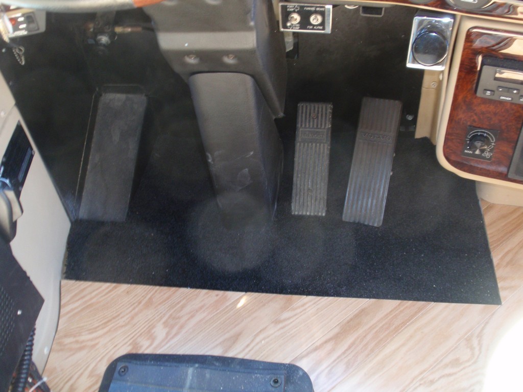 New wood floor being installed on driver side floorboard by Excalibur Coach - Prevost Motorhome H3-45 - XL - XLII - Entertainer - Class A