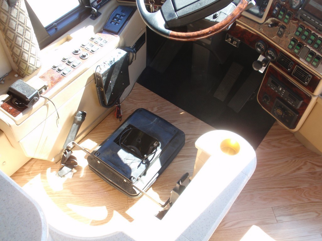New wood floor being installed on driver side floorboard by Excalibur Coach - Prevost Motorhome H3-45 - XL - XLII - Entertainer - Class A