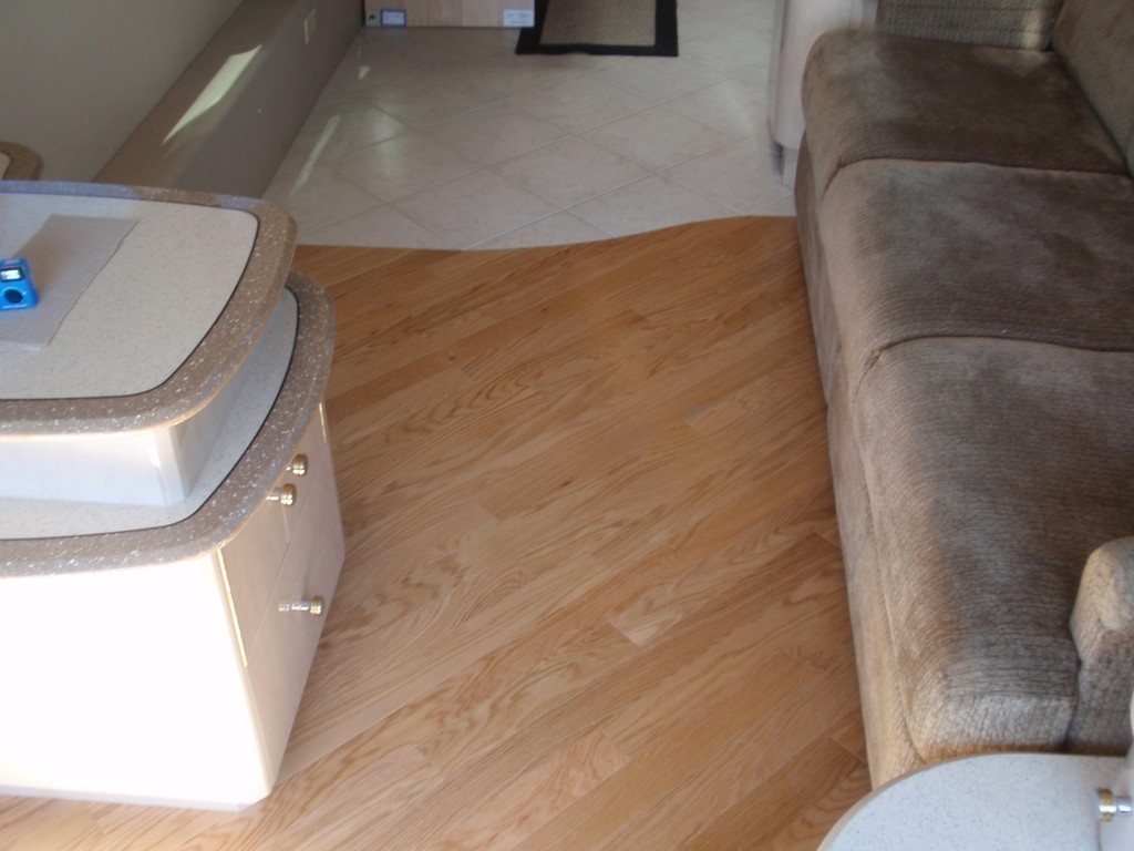 Prevost H3-45 XLII Motorhomes Class A - New wood floor in Salon by Excalibur Coach