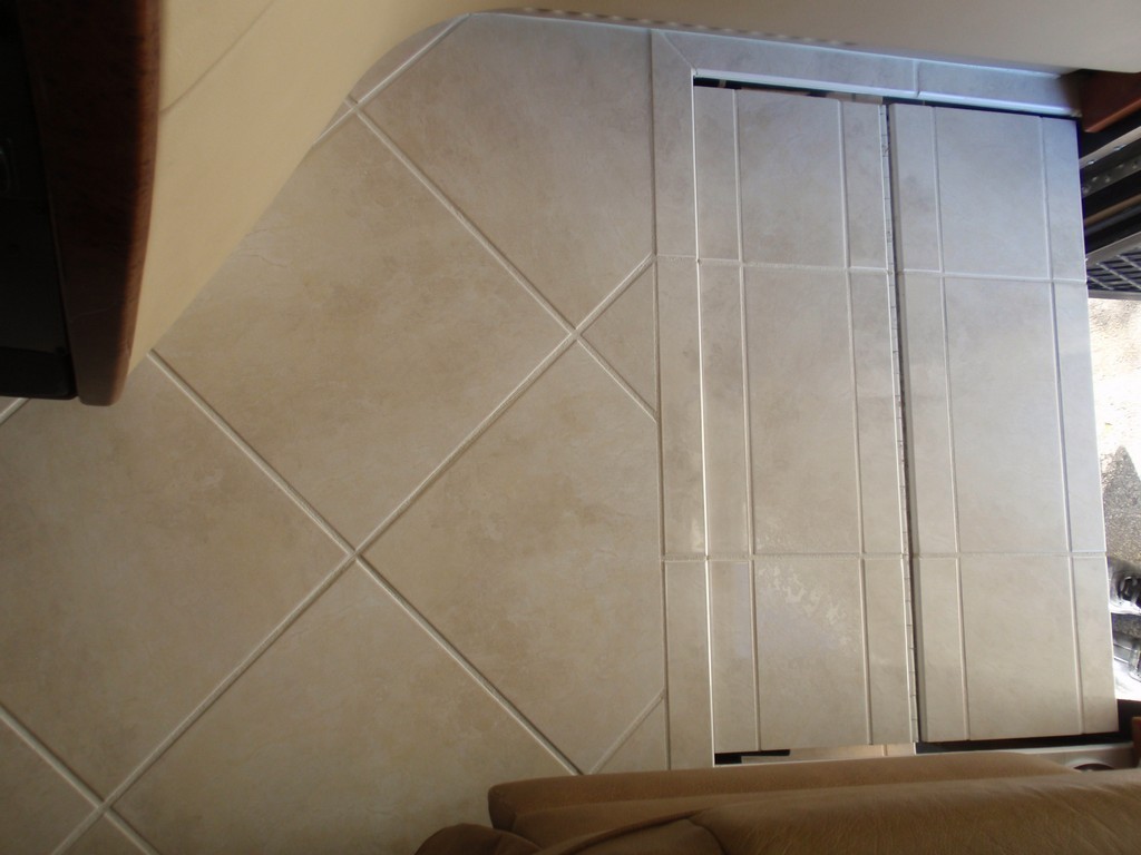 Prevost Monaco new porcelin flooring on entrance steps by Excalibur Coach - Prevost Motorhome H3-45 - XL - XLII - Entertainer - Class A