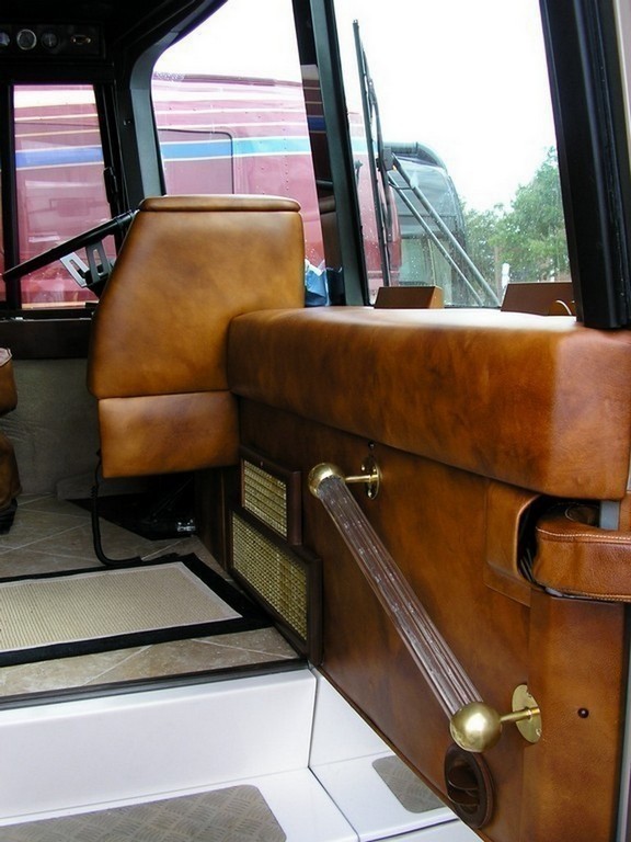 Prevost Motrohome Class A - New upholstery on entry panel and dash by Excalibur Coach