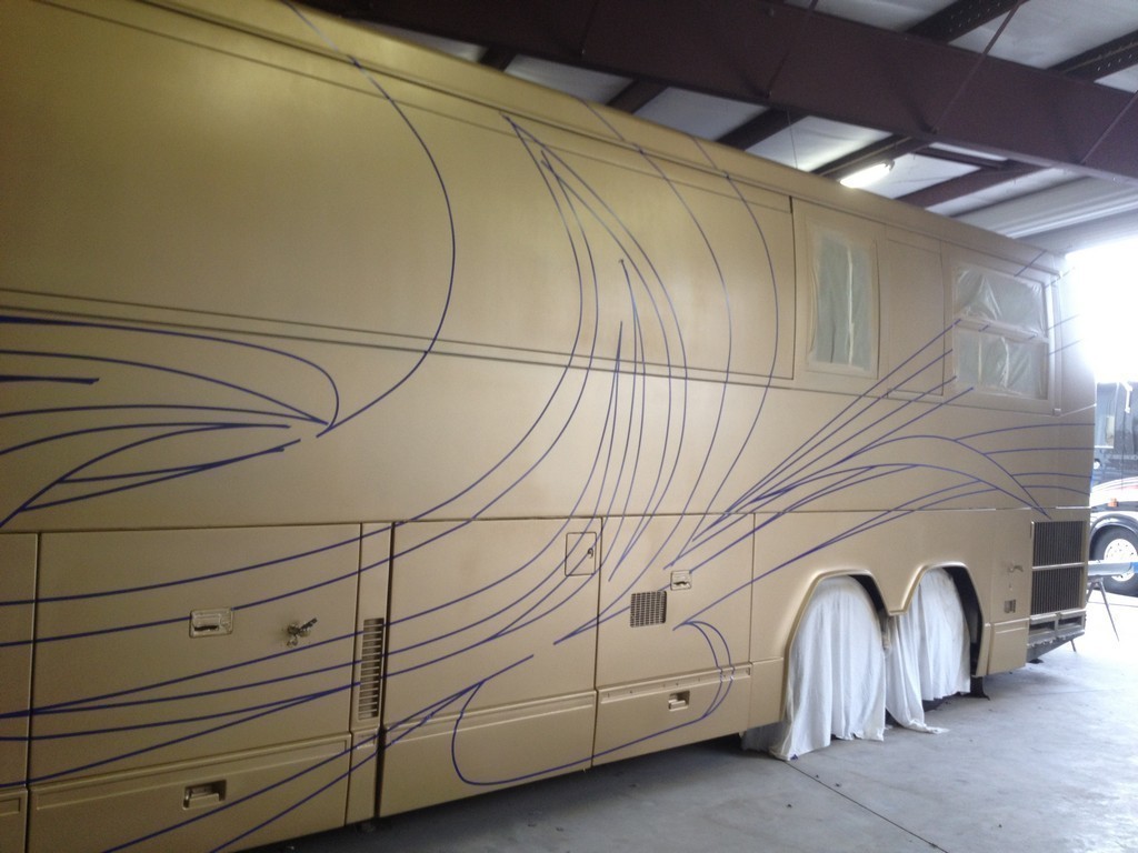 Prevost H3-45 XL XLII Motorhome - New paint and graphics side view by Excalibur Coach