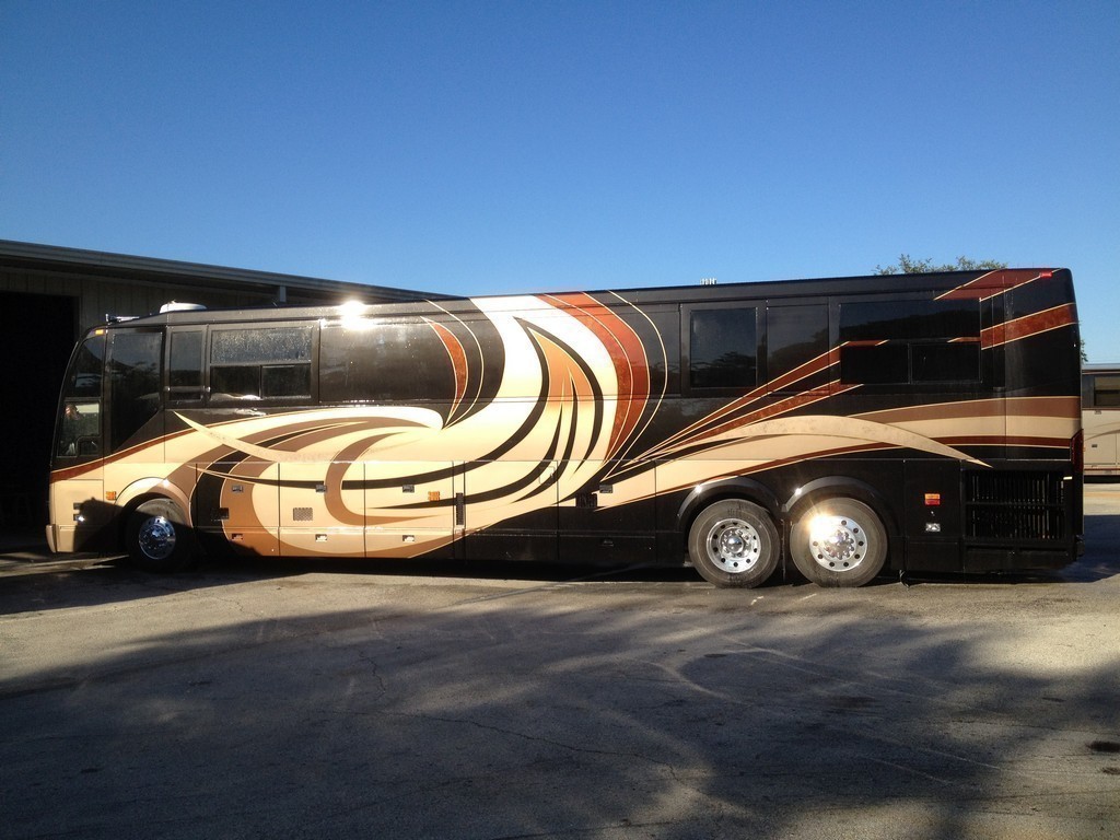 Prevost H3-45 XL XLII Motorhome - New paint and graphics driver side by Excalibur Coach