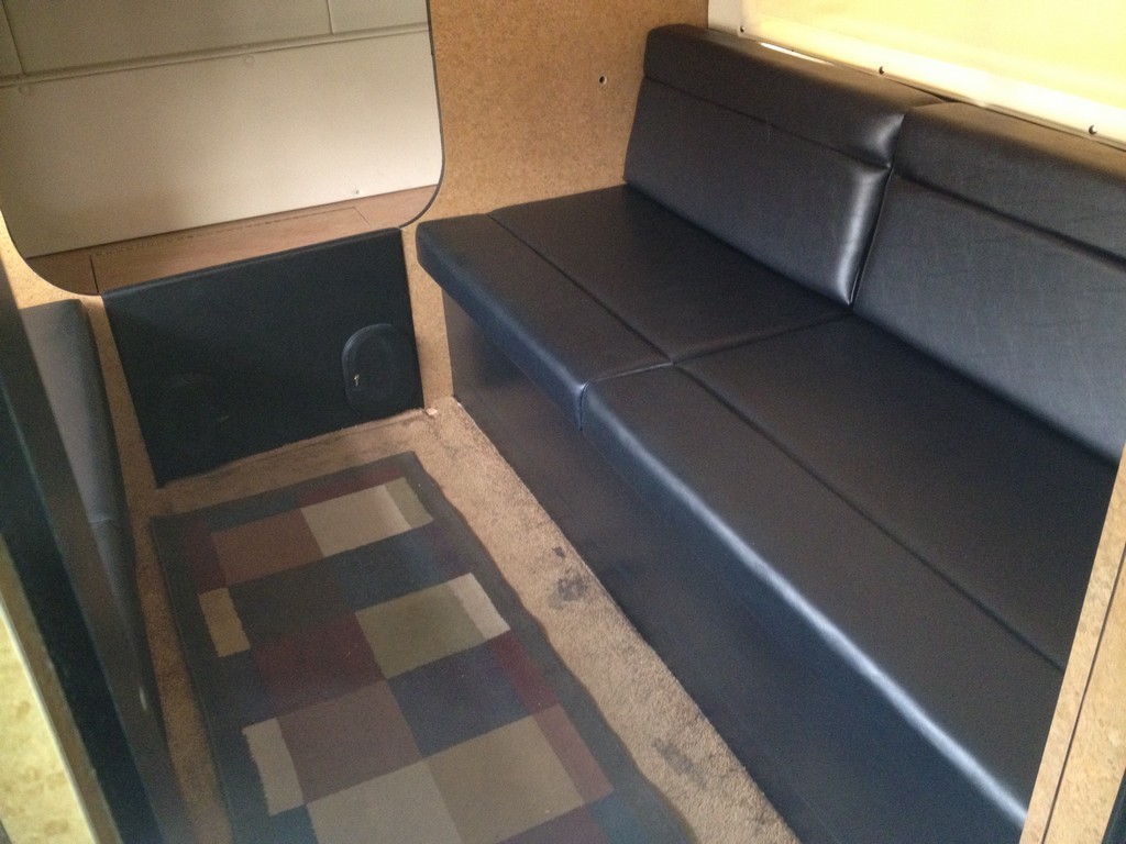 Prevost H3-45 Entertainer Bunk Coach Rear Salon Conversion by Excalibur Coach
