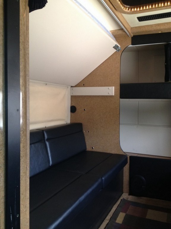 Prevost H3-45 Entertainer Bunk Coach Rear Salon Conversion by Excalibur Coach