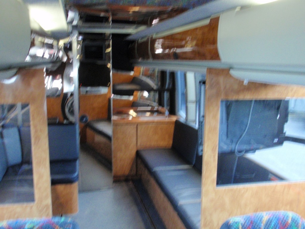 Prevost H3 Drivers side with 32 inch TV by Excalibur Coach