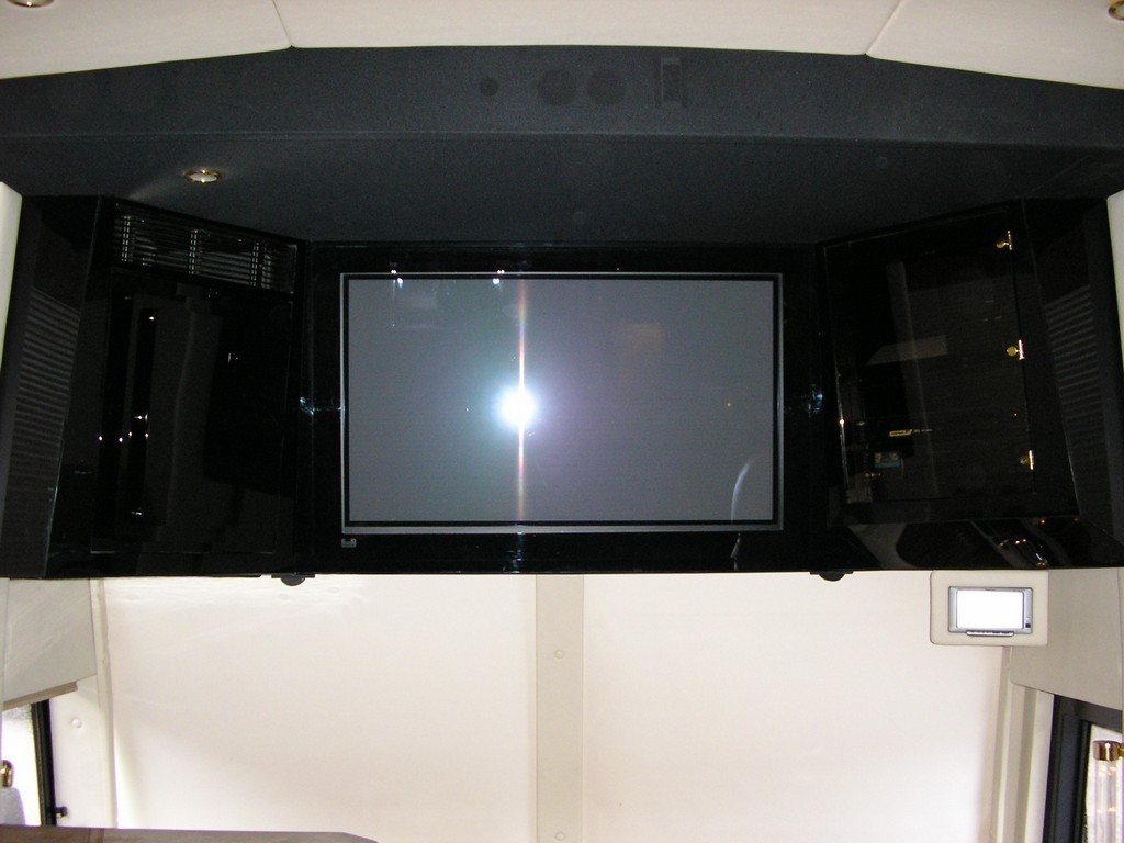 Custom TV cabinet in front of coach by Excalibur
