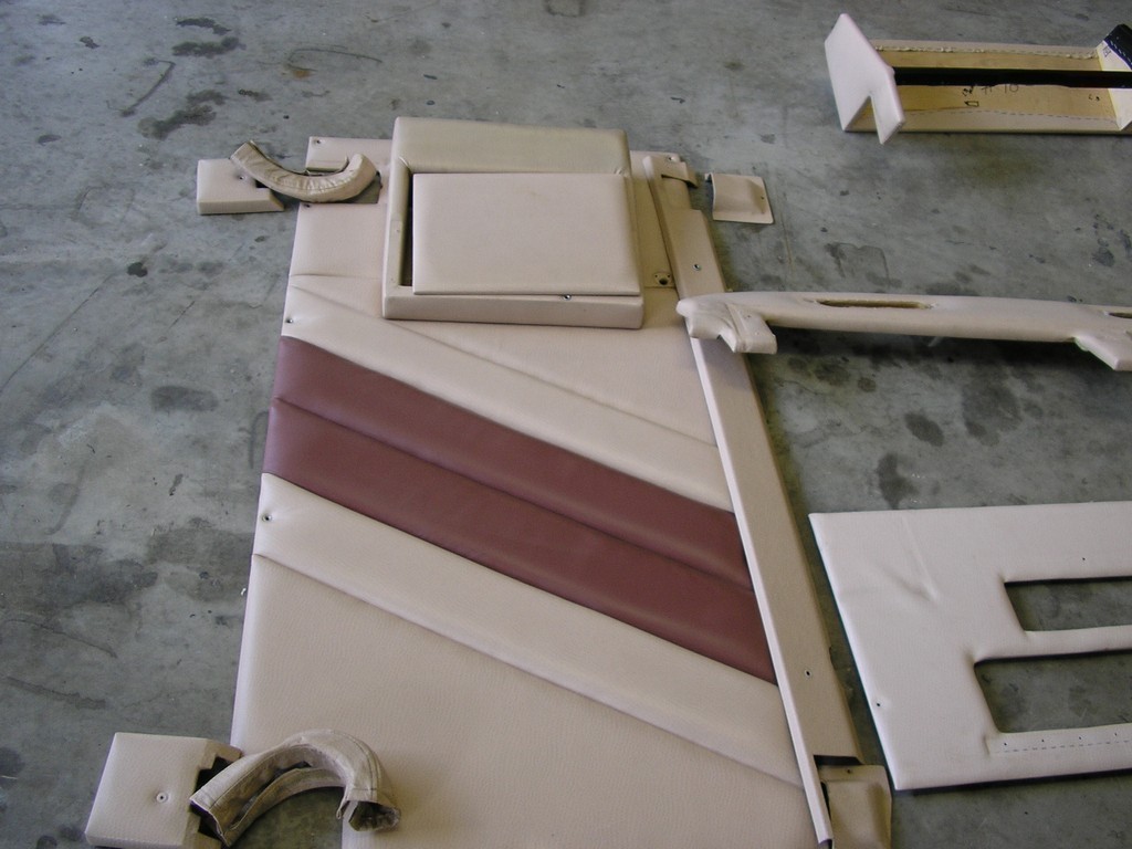 Entry door panel before new upholstery by Excalibur