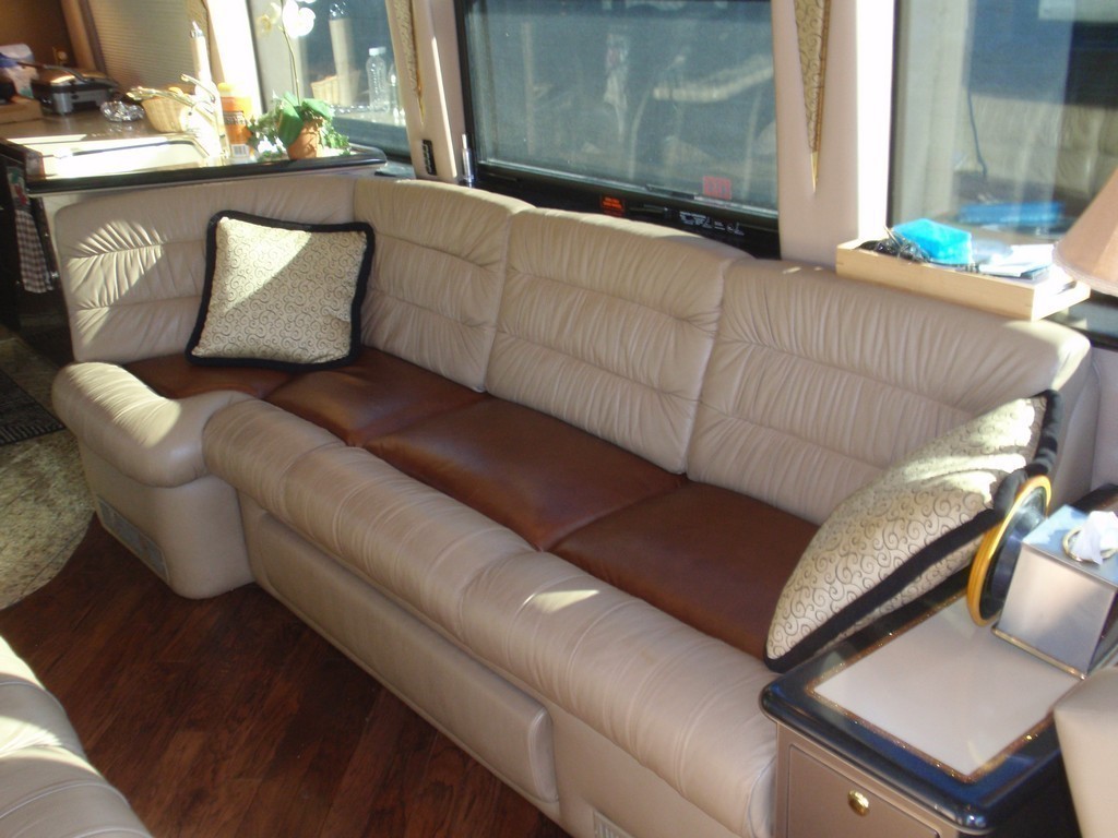 Prevost H3-45 with new upholstery on driver side salon sofa