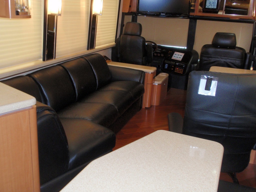Prevost Motorhome New leather upholstery on salon sofa by Excalibur