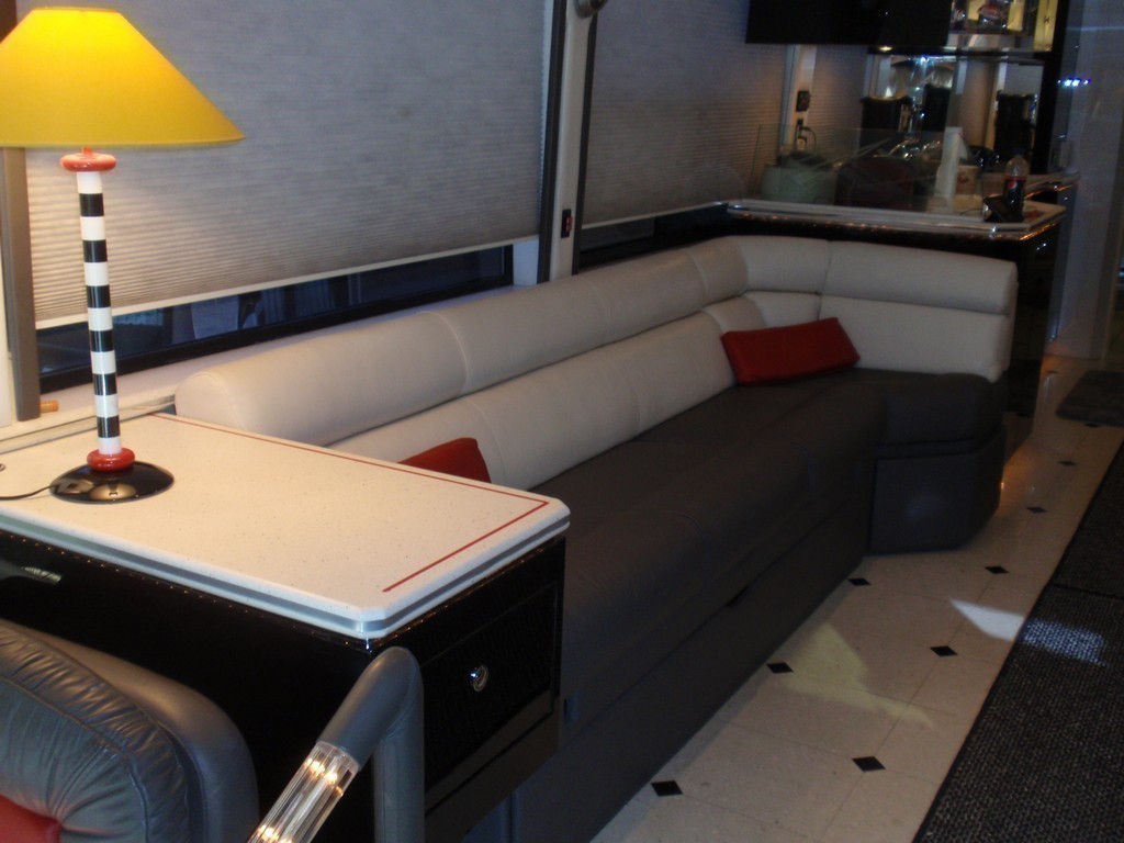 New upholstery on salon sofa by Excalibur - Prevost Motorhome Coach
