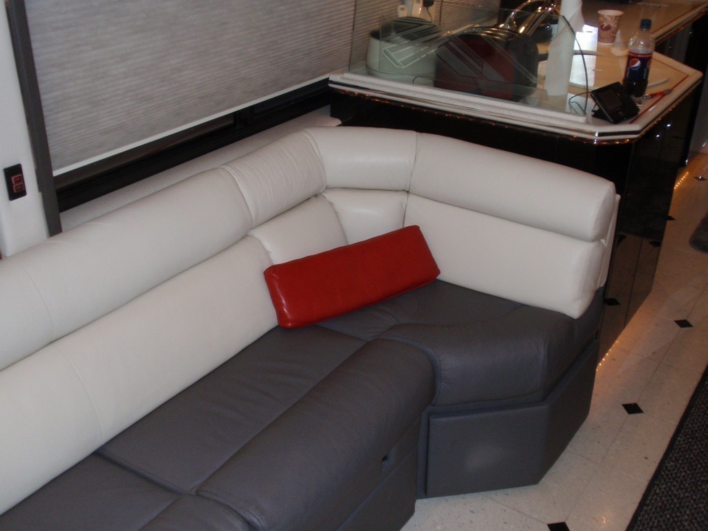 New upholstery on salon sofa by Excalibur - Prevost Motorhome Coach