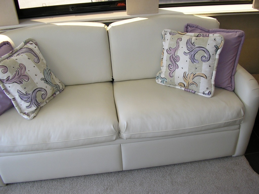 New upholstery on salon sofa by Excalibur - Prevost motorhome coach